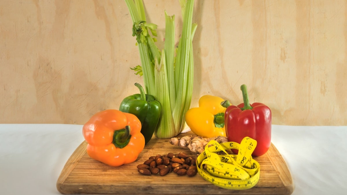 a wooden cutting board topped with assorted vegetables